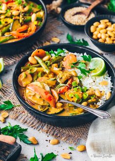 several bowls filled with different types of food