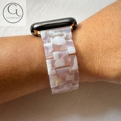 🌈 Elevate your Apple Watch with our White Pink Resin Band - a vibrant expression of style and versatility available in enchanting shades such as White, Pink, with rose gold hardware. 🎨 🛍️ Your Purchase Includes: 1x White Pink Resin Band for Apple Watch ✨ A Palette of Vibrant Choices Embrace the beauty of choice as you explore our rich spectrum of colors. From the playful allure of Pink to the calming essence of Blue, find the hue that mirrors your individuality. ⌚ Designed for Tailored Comfort Our Pattern Resin Band ensures a comfortable fit for wrists spanning 5.3' to 7.5", ensuring you wear your Apple Watch with a blend of elegance and ease. 💍 A Fusion of Style and Functionality Experience the perfect blend of style and practicality. Our Resin Band is not just an accessory; it's a st Trendy White Rectangular Watch Accessories, Trendy White Apple Watch Band With Bracelet Strap, Trendy Apple Watch Bracelet Strap, Trendy White Watch Accessories With Bracelet Strap, Trendy White Bracelet Strap For Watches, Trendy White Bracelet Strap Apple Watch Band, Luxury Pink Watch Band With Bracelet Strap, Modern Pink Bracelet Strap Watch Bands, Pink Apple Watch Band With Bracelet Strap