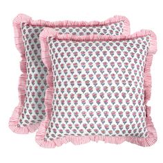 two pink and white pillows with ruffled edges