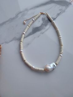 Discover elegance with our handcrafted Howlite Necklace, interwoven with delicate freshwater pearls and featuring a stunning baroque pearl centerpiece. This necklace measures a versatile 40 cm (15.75 inches) in length, plus a 6 cm (2.36 inches) extendable chain for adjustable fitting. Designed to capture the essence of sophistication, its creamy white hue makes it a perfect statement piece for holidays or any special event. Whether you're dressing up for a romantic evening, attending a formal ev Pearl Centerpiece, Howlite Necklace, Romantic Evening, Freshwater Pearl Necklace, Freshwater Pearl Necklaces, Special Friend, Baroque Pearls, Creamy White, Stone Necklace