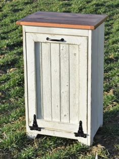 This primitive trash bin will be perfect for the kitchen, office and more spaces of your country home.  Includes plastic 10 gallon trash bin.   33 H X 20" W X 14 1/2"D.  Many colors to choose from. Black, Burgandy, Cream, White, or a custom color. Custom sizes can be made! This is pictured and priced in the size   32" high x 22" wide  x 12" deep Recycling Storage, Falling Waters, Punched Tin, Quilt Rack, Pie Safe, Wood Pumpkins, Country Quilts, Trash Bin, Trash Bins