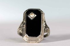 an antique black onyxite and diamond ring