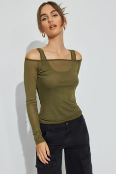 This top is absolute baddie mode. The layering options... our heads are spinning. Features - Layered Construction - Off-the-shoulder neckline - Fixed shoulder straps at underlay - Sheer mesh Size & Fit - Fit: Fit and stretch - Length: Cropped - Model is wearing size S Materials & Care - Content: 90% polyester, 10% spandex - Care: Machine wash, cold - Imported Layered Mesh Top Outfit, Mesh Top Outfit, Tank Top Layering, Layered Crop Top, One Shoulder Shirt, Outfits 2000s, Layering Tank Tops, Mesh Long Sleeve Top, Black Mesh Top