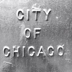 the city of chicago sign is etched into an old metal plate with writing on it