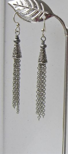 Long Tassel Earrings ~ These stunning chain dangle earrings are made with varying lengths of antiqued silver chain to give them a vintage feel. These long chain earrings are my go-to earrings ~ they match everything! Makes a great gifts for her! The chandelier earrings measure 2.75" from the top of the earwires to the bottom of the longest chain. Coordinating tassel necklace also available for sale.Goth Earrings will be packaged on an earring card in a lovely organza bag; along a note card indic Silver Metal Tassel Earrings Gift, Silver Tassel Earrings Gift, Silver Tassel Drop Earrings With Dangling Beads, Silver Latkan Tassel Drop Earrings, Silver Tassel Dangle Earrings, Silver Metal Tassel Drop Earrings, Silver Nickel-free Dangle Tassel Earrings, Silver Dangle Tassel Earrings With Latkans, Silver Nickel-free Drop Tassel Earrings