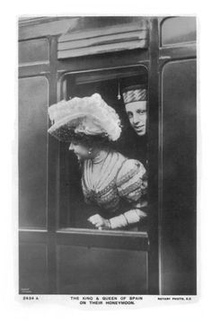 an old black and white photo of two people in a train car looking out the window