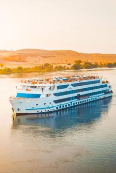 a large white boat floating on top of a body of water