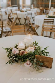 a table with candles and flowers on it