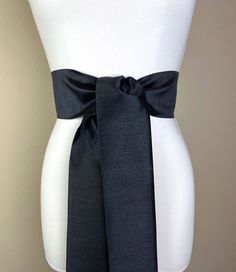 "Wide Textured Black Sash Belt  Black Dupioni Sash  Black Dress Sash  Dupioni Fabric Belt  Black Wedding Sash  Bridesmaid Dress  Satin Swank  Add sophistication and crisp texture to your special occasion outfit with this Satin Swank® dupioni waist sash. Depending on your waist size and the length you choose (75 and 90 inch lengths available), you can wrap this sash around your waist once or twice. You decide whether to tie the sash in a bow or a simple knot with long-hanging tails. Tie in front, Bridesmaid Dress Satin, Bridesmaid Dresses Satin, Occasion Outfit, Waist Sash, Dress Sash, Wedding Sash, Sash Belts, Special Occasion Outfits, Sash Belt