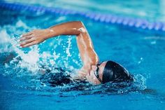 a swimmer is swimming in the pool