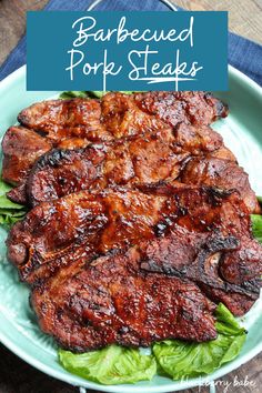 barbecued pork steaks with lettuce on a plate