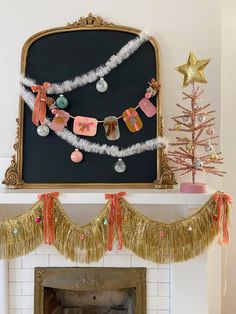 a decorated fireplace mantle with garland and decorations