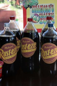 three bottles of rusteze are sitting on a table