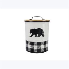 a black and white canister with a bear on it