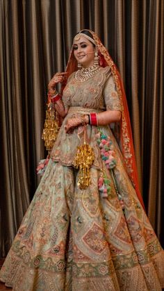 a woman in a wedding dress posing for the camera