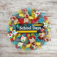 the school days wreath is made with colorful fabric and wooden pegs, along with a ruler