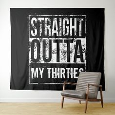 a black and white wall hanging with the words straight out, my thrifts on it