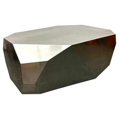 a large metal object sitting on top of a white surface with no one around it