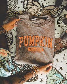 Get ready for fall with our Retro Pumpkin Season T-Shirt, a perfect blend of cozy and cute! This adorable fall coffee shirt is ideal for celebrating all your favorite autumn moments, from sipping on pumpkin spice lattes to enjoying crisp fall days. Designed for women who love the season, this shirt makes a great Thanksgiving gift or a fun addition to your Halloween wardrobe. The retro pumpkin design brings a nostalgic vibe, while the soft, comfortable fabric ensures you'll stay cozy all season l Casual Brown T-shirt For Fall, Everyday Fall T-shirt With Letter Print, Brown Graphic Print T-shirt For Fall, Brown Letter Print T-shirt For Fall, Fall Orange Top For Everyday, Orange Everyday Top For Fall, Orange Top For Everyday Fall Wear, Orange Letter Print T-shirt For Fall, Orange T-shirt With Letter Print For Fall