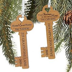 two wooden key ornaments hanging from a christmas tree