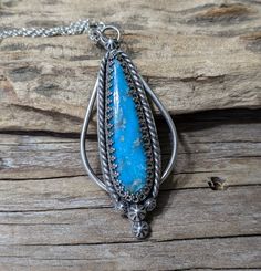 This pendant was made with Argentium Silver and Kingman Turquoise. It measures nearly 2.5 inches long by 1 inch wide. The Argentium Silver chain measures 17 inches. Artisan Blue Turquoise Necklace Untreated, Blue Turquoise Necklace With Large Teardrop Stone, Unique Blue Teardrop Turquoise Necklace, Artisan Blue Turquoise Teardrop Pendant Necklace, Handmade Southwestern Necklace With Teardrop Pendant, Handmade Southwestern Teardrop Pendant Necklace, Collectible Blue Turquoise Necklace With Large Pendant, Artisan Blue Turquoise Necklace With Patina, Blue Turquoise Necklace With Large Pendant