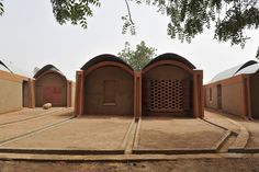 an outdoor area with several small buildings in it