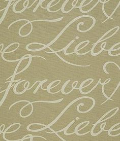 the words are written in cursive writing on a beige background with white ink