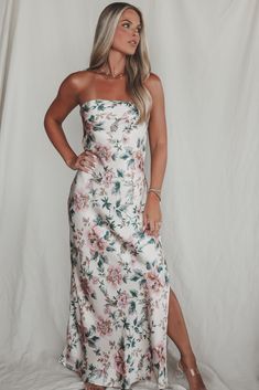 Bestieeee you look good so obviously all eyes on you! Pair with a pretty neutral heel or make it fun with a pink or green pop or color! Ivory satin strapless maxi dress, pretty pink and green floral print, side side, dress is lined Material is Polyester Hang to dry ‘Model is 5’7 wearing a small SHOP THE LOOK Small Medium Large Length 50’ 51’ 52’ Bust 14.5’ 15.5’ 16.5’ Fitted Strapless Floral Maxi Dress, Spring Strapless Maxi Dress With Floral Print, Feminine Strapless Floral Maxi Dress, White Strapless Maxi Dress With Floral Print, Strapless Pink Floral Print Maxi Dress, Wedding Guest Romper, Party Bottoms, Side Dress, Neutral Heels