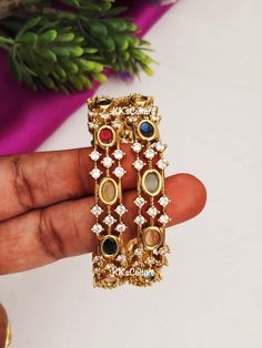 Navratan Diamond Bangles studded with multicolor semi precious stones with CZ's in gold finish. A perfect piece of art always a keeper in your jewelry trinket that goes with Ethnic Attire /  Indian outfits.  👉🏻Size Available: suitable for bangle size 2.4 / 2.6 / 2.8  👉🏻Premium Quality CZ & semi precious stones that's all it goes in here.  ✅Check other styles available in our store https://www.etsy.com/shop/KKsCulture Send us an email if you need help!  SHIPPING & TURNAROUND  👉🏻Please check listings for shipping and turnaround times.  👉🏻We follow item dispatch in 1-2 business days for most of our shipments.  👉🏻All pre orders will take approximately 3 weeks. 👉🏻Free domestic delivery across US on orders over $35.  For any other query or assistance with shipping, custom / bulk orde Navratan Bangles, Jewelry Indian Wedding, Diamond Bangles, Temple Jewelry, Art Deco Bracelet, Jewelry Trinket, Black Beaded Jewelry, Indian Wedding Jewelry, Jewelry Indian