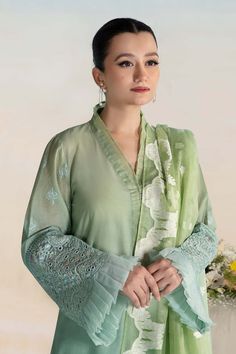 Classic Mint Green Maria B Luxury Formal Pakistani Salwar Suit has an alluring gold shade that will give you a head-turning look on the big day. Delivery: 7 Business Days Detailed Description: SKU: PB688 Detailing: Embroidery, Threads, Sequins, Motifs, Stones Color: Mint Green Fabric: Organza, Chiffon, Net Design: Fully Embellished Dress with Embroidery Event: Party wear, Festive Pakistani Salwar Suit, Pakistani Salwar, Chiffon Sleeves, Pakistani Salwar Kameez, Eid Dresses, Maria B, Embroidered Border, Lace Neckline, Organza Dupatta