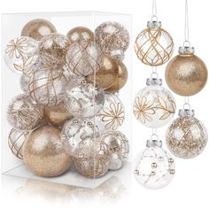 a box filled with gold and white christmas ornaments