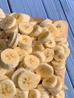 sliced bananas on a wooden cutting board