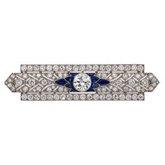 A fine Art Deco diamond and sapphire bar brooch, to the centre a transitional brilliant-cut diamond estimated to weigh 1.75 carats, assessed colour H-I, assessed clarity VS1-2, set between five fancy-cut sapphires on each side, to an openwork diamond-set plaque of geometric design, all within two rows of old European-cut diamonds, the diamonds estimated to weigh 6 carats in total, all millegrain-set in platinum mount, with platinum pin fitting, circa 1930, measuring approximately 6.3 x 1.5cm, gr Brooch Art, Art Deco Brooch, Diamond Brooch, Jewellery Shop, Bespoke Jewellery, European Cut Diamonds, Art Deco Diamond, Art Deco Jewelry, Dream Jewelry