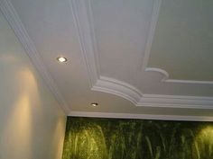 the ceiling in this room is decorated with green wallpaper