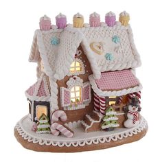 a gingerbread house with lights and decorations