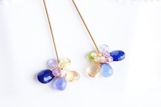 "Using blue sapphire, tanzanite, citrine, peridot, amethyst and crystal quartz, wrapped into dainty flower. Perfect for any woman that simply wants to add a touch of feminine to her wardrobe. They are light weight, will match with pair of jeans or fancy dress. 14k gold filled, Sapphire, Tanzanite, Citrine, Crystal quartz, Peridot Total length of the earrings is 1.7\" (4.2cm) Come in gift box Made to order Your earrings will arrive to you in a gift box for safe travel and safe keeping. If you int Elegant Multi-stone Briolette Earrings, Elegant 14k Gold Filled Briolette Earrings, Elegant Multi-stone 14k Gold Earrings, Elegant 14k Gold Filled Earrings With Natural Stones, Unique Gemstones, Delicate Earrings, Flower Jewellery, Chandelier Earrings, Long Earrings