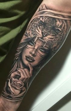 a woman with a tiger and roses tattoo on her arm