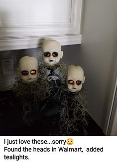 three creepy looking heads in front of a window with text that reads, i just love these sorry found the heads in walmart added tealights