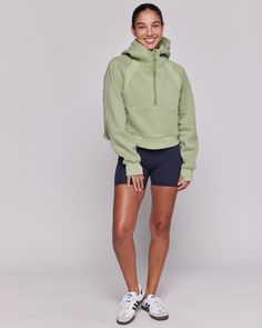 Unwind in style with our boxy half zip hoodie silhouette. It's a loungewear game changer. Wear it to and from practice. Made in our irresistibly soft fleece scuba fabric. Features a semi crop length that lands just below the waist, a funnel neck, pockets, and thumbholes. Machine Wash Model is 5'7" wearing size XS/S Athleisure Half-zip Sweatshirt For Loungewear, Sportswear Half-zip Hoodie With Ribbed Cuffs, Sportswear Hoodie With Half-zip And Ribbed Cuffs, Sportswear Hoodie With Ribbed Cuffs And Half-zip, Cozy Half-zip Hoodie For Loungewear, Functional Half-zip Hoodie With Ribbed Cuffs, Half-zip Fleece Hoodie Sportswear, Sporty Half-zip Sweats For Loungewear, Half-zip Fleece Sweats In Athleisure Style