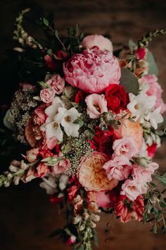 a bouquet of flowers sitting on top of a table