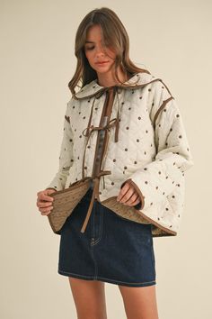 Fits TTS- the model is wearing a small. The Penny Polkadot Quilted Jacket is a brown and cream polkadot embroidered quilted jacket with reversible corduroy side. Contrast: 100% Cotton, Lining: 100% Polyester The Model, Cute Fits, Quilted Jacket, Sales Gifts, Outerwear Jackets, Boutique Clothing, Jacket Dress, Penny, Sweater Top