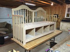 a baby crib is being built in a garage