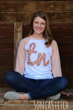 Show your Tennessee pride when you wear this baseball tee with a Tennessee applique in a delicate floral fabric. This is a super soft, super comfy Bella + Canvas Unisex baseball tee offered in a white body with peach sleeves. Sizes available are Small through 2X. The sizes are described as Unisex, retail fit. If you need more information, send me a message and I can give you more information. Each shirt is hand decorated in a smoke free home. ---Ordering information--- Select your size from the Tennessee Baseball, Custom Caps, Burp Cloth Set, Monogram Styles, Hand Decorated, Floral Shirt, Different Fabrics, Floral Fabric, Favorite Shirts