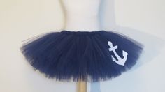 there is a mannequin with a blue tutu and an anchor on it