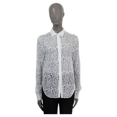 100% authentic Christian Dior semi sheer lace shirt in white cotton (77%) and polyamide (23%). Features long sleeves, buttoned cuffs and the 'CD' logo on the front. Opens with seven buttons on the front. Unlined. Has been worn and is in excellent condition. Measurements Tag Size 38 Size S Shoulder Width 43cm (16.8in) Bust 90cm (35.1in) to 98cm (38.2in) Waist 86cm (33.5in) to 92cm (35.9in) Hips 86cm (33.5in) to 92cm (35.9in) Length 76cm (29.6in) Sleeve Length 66cm (25.7in) All our listings includ Lace Button Up Shirt, Sheer Lace Shirt, Lace Button, Lace Shirt, Sheer Lace, Button Up Shirt, Floral Lace, White Cotton, Christian Dior