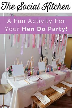 the social kitchen has been set up for hen do party with pink and white streamers