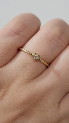 Diamond Heart-Shape Ring, Tiny 2MM Diamond Ring Women, Dainty Minimal Diamond Ring, Promise Ring, 14k Gold Stackable Ring, White, Rose Gold  Made in NYC - Custom Gold Color: Rose Gold, Yellow Gold, White Gold, in 14k  - Shank Width: 1.3mm - Diamond Shape: heart shape  - Number of Stones: 1 - Diamond Size: 2.2 mm - Total CTW:0.04 Ctw   - Diamond Color-Clarity: G-H / SI - Setting Type: Prong Setting  - Finish: high polish  We use only CONFLICT-FREE MINED DIAMONDS. This ring can be made in any ring 14k Gold Heart Ring With Single Diamond For Gift, Valentine's Day Single Diamond Ring In Fine Jewelry Style, 14k Gold Heart Ring With Single Diamond, Heart Shaped Single Diamond Ring For Gift, 14k Gold Heart Ring With Birthstone For Promise, Heart-shaped Single Diamond Ring Gift, Heart Shaped Single Diamond Gift Ring, Heart-shaped Single Diamond Gift Ring, 14k Gold Heart-shaped Solitaire Ring