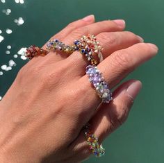 "Welcome to Hidden Glass Atelier! Glad you have found me  ✦ DESIGN    ✧ Ring crown: colorful dots cluster build up one by one by hand with tiny glass rods.    ✧ Ring band: signature Venetian multiple-color twisted design, in Italian, is called \"zanfirico\".      ✧ Styling: This bold yet romantic ring is elegant to wear alone, or stack with other metal rings for an interesting mix of material look and a pop of color. It is easy to wear up or down with a casual outfit or for a special occasion.     ✧ Durability: All the glass jewelry pieces are tempered by a professional kiln to provide maximum durability.    ✧ Origin: This one-of-a-kind glass ring will be custom handmade for you by me from Murano Venice Italy - the very heart of glass art since the Middle Ages, with Murano glass, my origin Adjustable Multicolor Crystal Ring For Party, Unique Multicolor Rings For Party, Rainbow Ring For Party Jewelry, Rainbow Ring For Parties, Rainbow Party Ring Jewelry, Colorful Handmade Ring Gift, Colorful Handmade Rings As Gift, Colorful Handmade Rings For Gifts, Cute Multicolor Round Rings