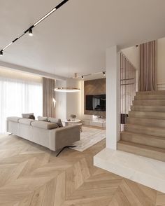 a living room filled with furniture next to a stair case in front of a flat screen tv