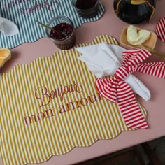 the table is covered with napkins and condiments for an event or celebration